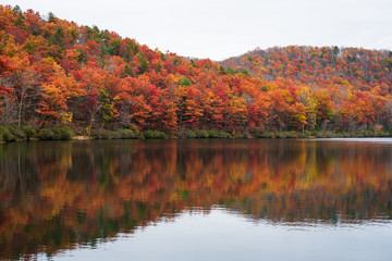 Autumn reflections at Sherando Lake, near the Blue Ridge Parkway in George Washington National Forest, Virginia.