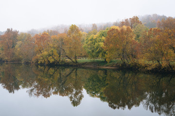 Fog and autumn color on the James River, from the Blue Ridge Parkway in Virginia.