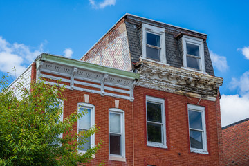 Fototapeta na wymiar Row houses near Hollins Market, in Baltimore, Maryland