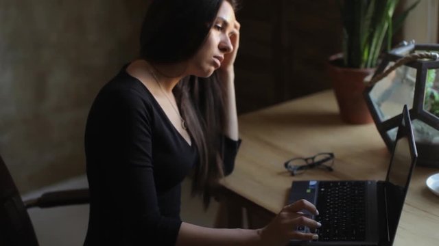 business woman working at home on a laptop computer