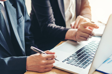 Business team colleagues meeting Planning Strategy Analysis discussing new plan financial on graph data new business project