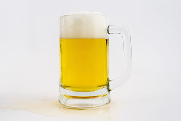 Mug with beer on white background