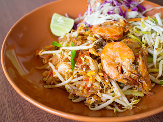 Thai Fried Noodles with shrimp and vegetables, Pad Thai On a wooden table