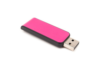 USB Pink flash drive memory on a white background, selective focus