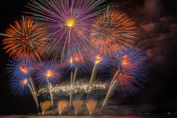 Fantastic Multicolor Firework Celebration from the big boat over the sea, celebration concept