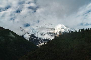 One of the peaks in the Annapurna Himalaya is barely visible among the clouds