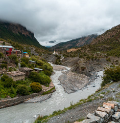 A cleaner glacier fed stream joins the muddy waters of The Marsyangdi River next to Lower Pisang