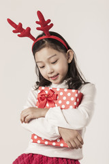 A asian girl hand hold a christmas gift on the white background.