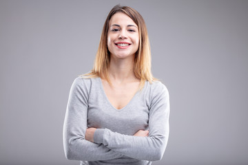 Happy young woman with crossed arms and shirt