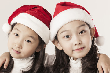 A asian girl portrait with santa hat isolated white.