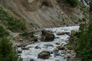 A broken bridge shows the dangers along the Annapurna Circuit Nepal near Chame over the Marsyangdi River