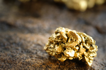 The pure gold ore found in the mine on a stone floor