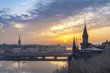 Fototapeta premium Stockholm sunrise city skyline at Gamla Stan and Slussen, Stockholm Sweden