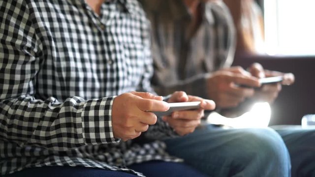Close up Couple with smartphones playing game