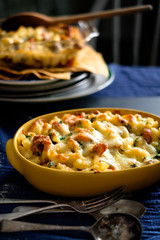 Baked rice with cheese on top.