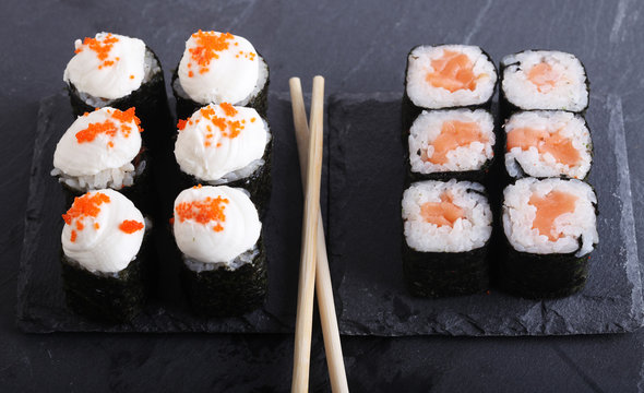 Maki rolls with over grey background. Japanese Sushi. close up. 