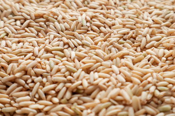 Raw brown rice. top view food background texture