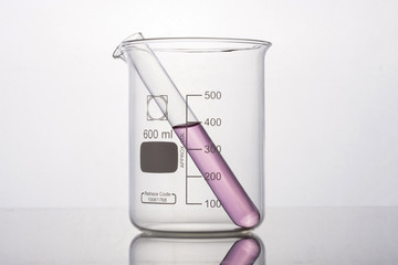 beaker and cylinder closeup isolated white.