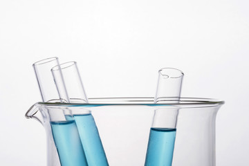 beaker and cylinder closeup isolated white.