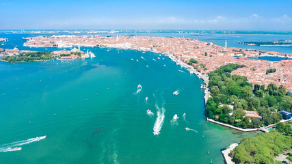 Aerial view of Venetian lagoon and cityscape of Venice island in sea from above, Italy
