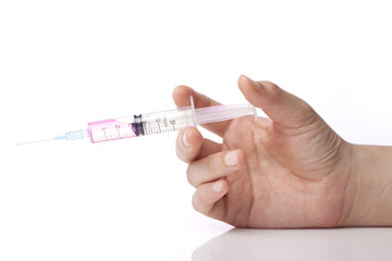 Fototapeta premium hand hold a syringe isolated white.