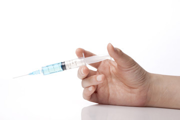 Fototapeta premium hand hold a syringe isolated white.