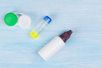 containers for storage of lenses for correction of vision and means for washing