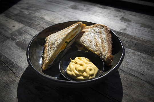 jaffle with egg, ham, green and hollandaise sauce