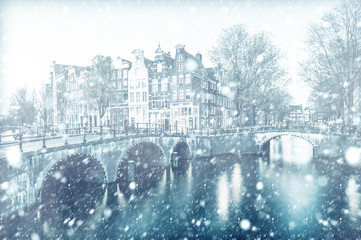 View of Amsterdam canal by night with snow