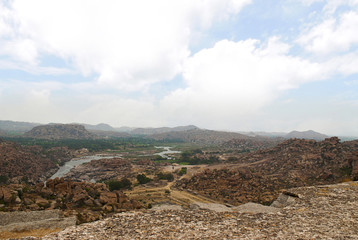 Arieal view of the chain of hills of Hampi from north side of Matanga Hill, Hampi, Karnataka. Sacred Center. The Anjeneya Hill is seen in the distance.