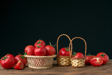 Fototapeta na wymiar tomatoes on wooden background