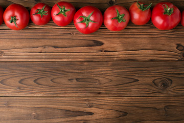 tomatoes on wooden background