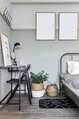 Cozy green bedroom corner with wooden frames decoration and modern gray metal bed  in modern vintage style / Cozy Interior concept