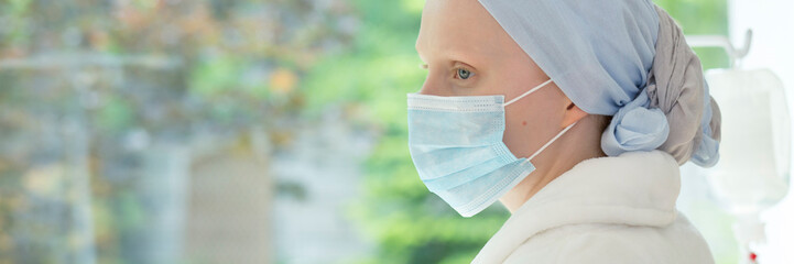 Panorama of weak woman with mask on face during treatment