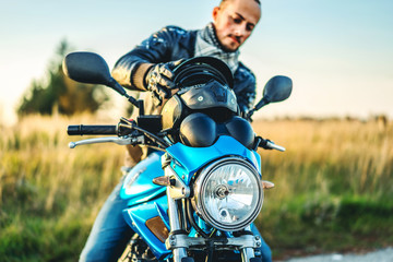 Man on sport motorcycle outdoor on the road