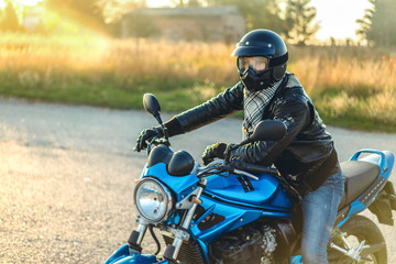 Man on sport motorcycle outdoor on the road