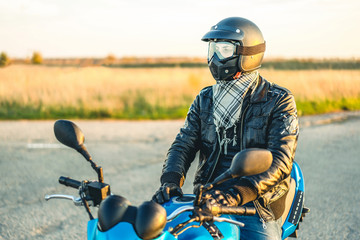 Man on sport motorcycle outdoor on the road