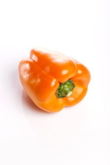 orange colored paprika isolated white.