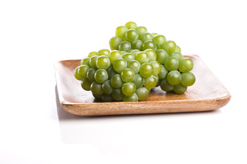green grapes on the white background.