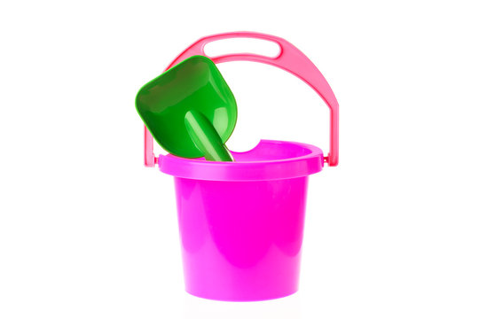 Colorful toy bucket and shovel isolated on white background. Toys for kids.