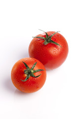 red tomato on the white background.
