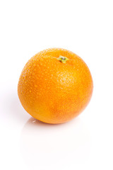 orange on the wood table, grey background.
