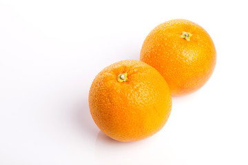 orange on the wood table, grey background.