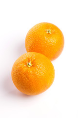 orange on the wood table, grey background.