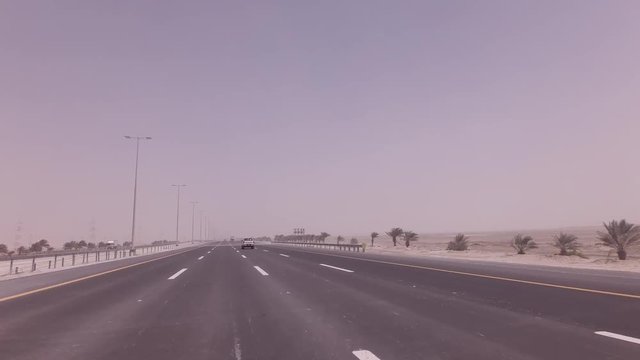 Sandstorm sweeps the sand on highway stock footage video