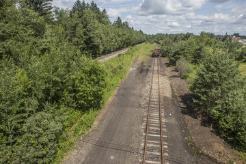 Abandoned railroad cuts through the forest that used to be the main line for shipment