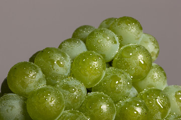 fresh fruits(green grape) on the wood table, grey background.