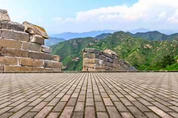 Empty square floor and great wall with mountains