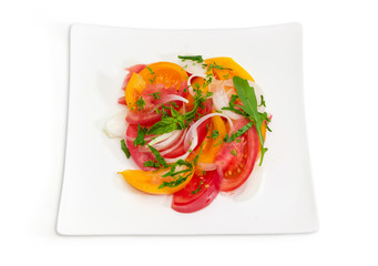 Top view of salad of red and yellow tomatoes