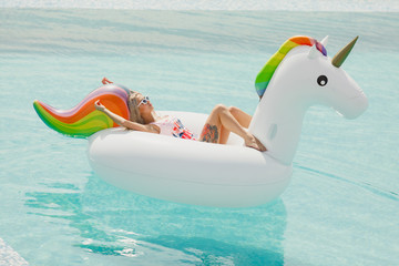Enjoying suntan Woman in bikini in the swimming pool. Summer Vacation © Gennady Danilkin
